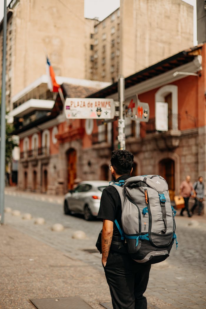 why-choose-us A backpacker exploring the streets near Plaza de Armas, Santiago, Chile.
